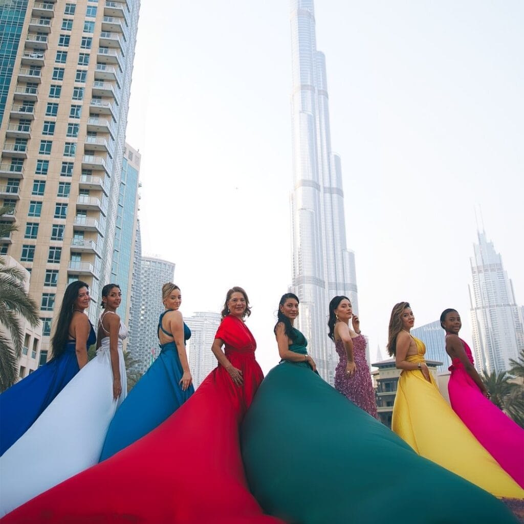 Group flying dress photoshoot in Dubai city with colorful dresses and luxury professional photography experience