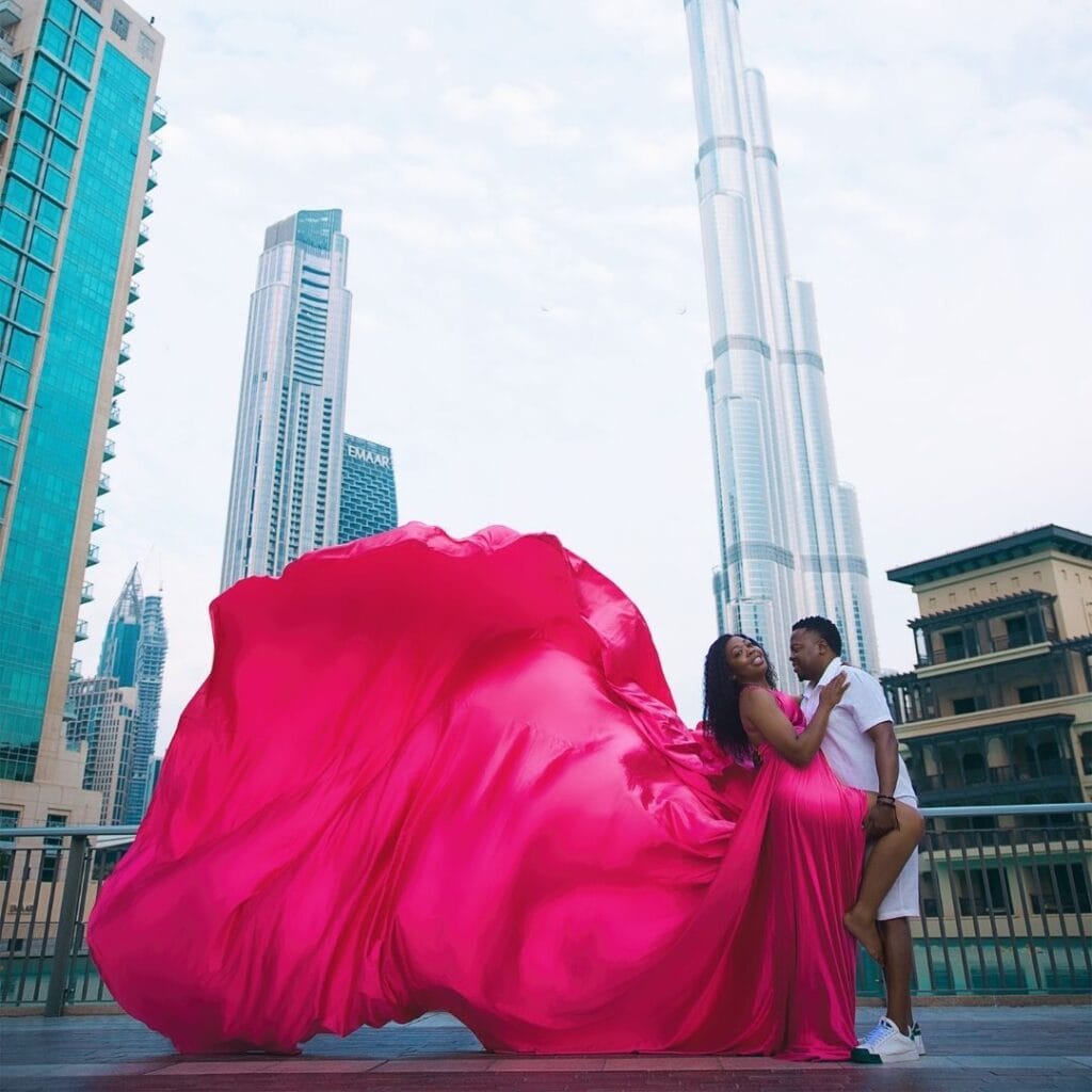 Pink flying dress photoshoot in Dubai city with Burj Khalifa and luxury professional photography experience