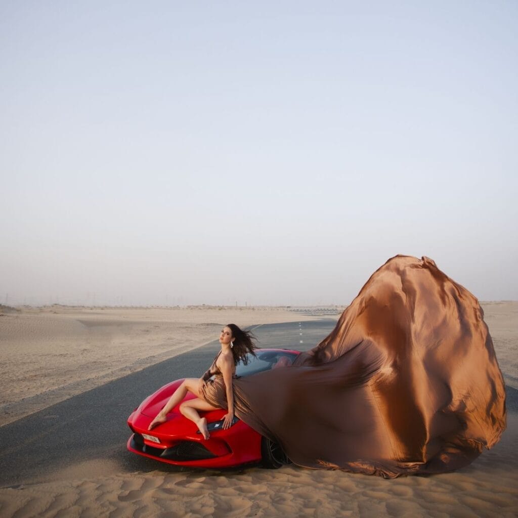 Brown flying dress photoshoot in Dubai desert with luxury professional photography experience