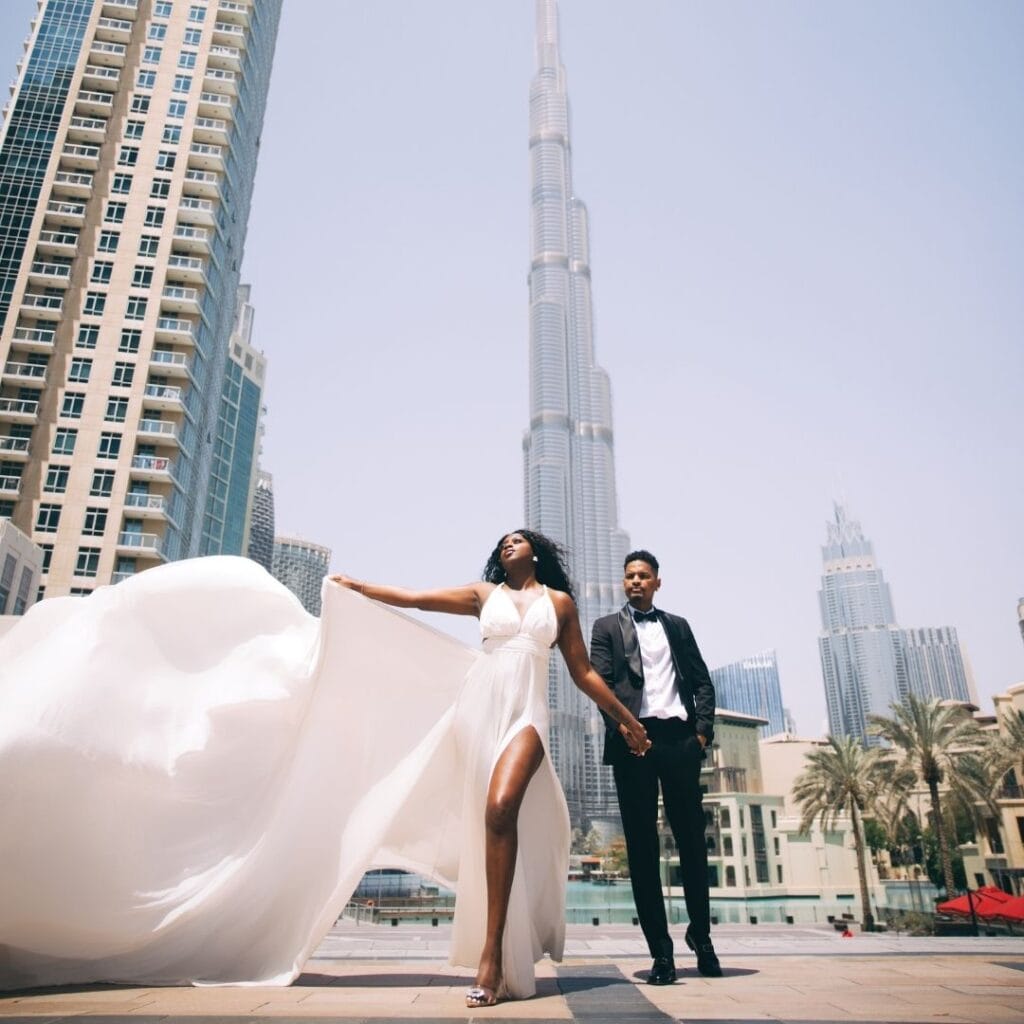 Couple white flying dress photoshoot in Dubai city with Burj Khalifa and luxury professional photography experience